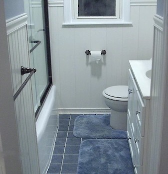 This bathroom remodel was down to the studs; everything was done over and that includes a heated tile floor and a timed exhaust fan that shuts off 10 min. after you leave.  The cast iron tub actually stayed in place and was re-glazed.
